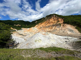 Noboribetsu Hell Valley with boiling springs area in summer Hokkaido, Japan.