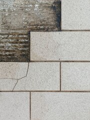 white brick wall and Broken tile walkway waiting for repair