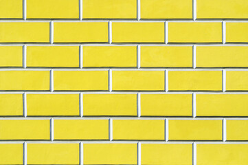 Brick wall background - new bricks wall pattern, brick wall of bright yellow color