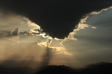 a cloud resembling an inverted mountain