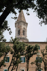 Tower against the background of the facade of an old building