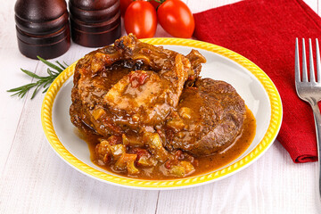 Italian cuisine - ossobuco with sauce