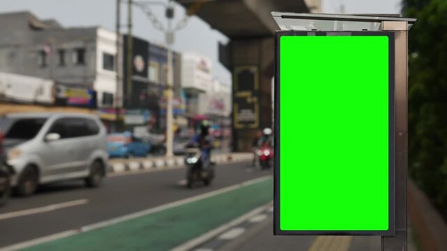 Green wrinkled poster template in city. Glued paper mockup. Empty street art sticker mock up. Clear urban glued advertising canvas. Billboard advertisment advertiser.