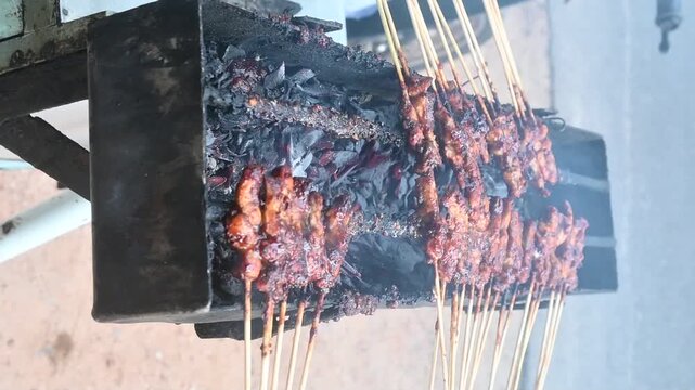 grilled satay on a charcoal grill
