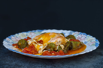 Fried tomatoes and peppers with eggs. Turkish cuisine.