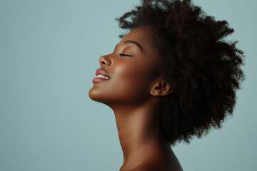 A close up of a black woman's face with her eyes closed