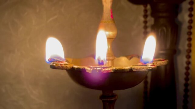 Traditional lamp, known as a diya or deepam, typically used in Hindu rituals and ceremonies