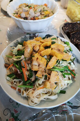 Rice vermicelli with mushrooms on a plate, a dish for Chinese New Year