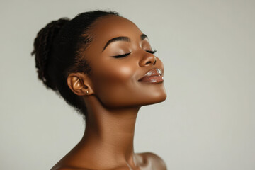 A close up of a black woman's face with her eyes closed