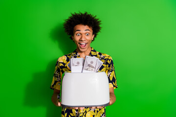Photo of cheerful crazy cool man wear stylish print clothes hand hold toaster isolated on green color background