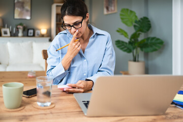 Business woman video call preparation. Young female businessperson prepare herself for online...
