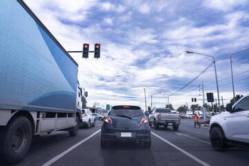 Obraz premium Rush hour cars, city roads, cars on the highway in traffic jam, waiting at traffic lights