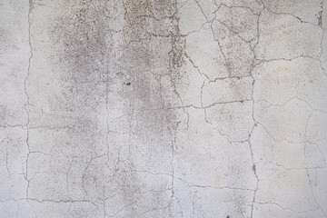 abstract background of an old shabby painted white wall close up