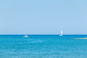 Fototapeta premium Greece Peloponnese region Poros island and Galatas town seaside sailing boats on the blue sea
