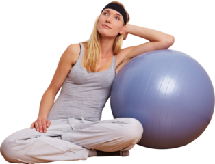 Frau lehnt an Gymnastikball