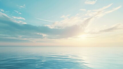 Obraz premium This image depicts a serene ocean scene at sunrise, with soft clouds scattered across the sky and calm waters below, evoking feelings of tranquility and peace.
