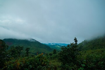A cloudy day with a mountain range in the background