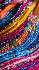 Colorful beads forming wavy pattern - arts and crafts background