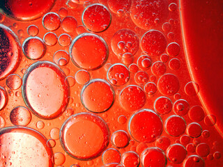 Abstract Background Red oil Macro Colorful artistic of oil drop floating on the water. macro red...