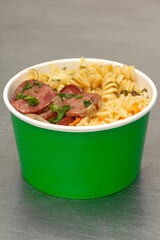 Bucket with Tuscan meal, rice and pasta.