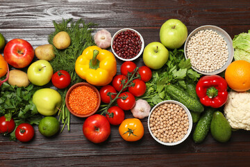 Different vegetarian products on wooden table, top view