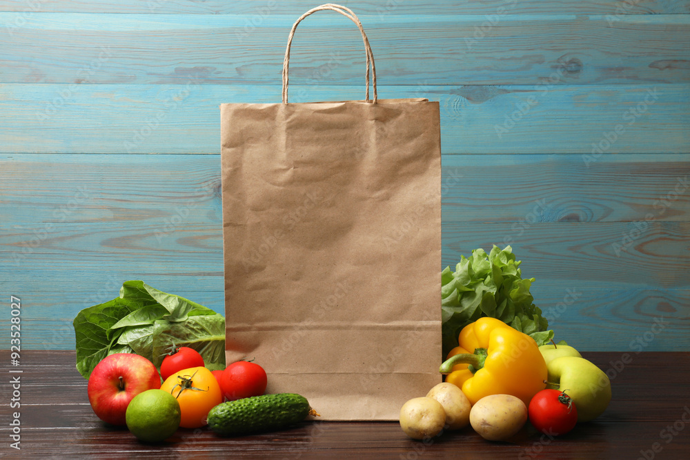 Canvas Prints Delivery of vegetarian products. Different vegetables, fruits and paper bag on wooden table