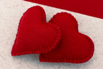Two red felt hearts. Macro. Felt hearts close-up for Valentine's Day.