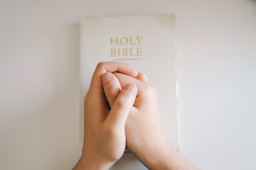 A Christian reads the Bible and drinks coffee. Reading the Holy Bible in temple. Concept for faith, spirituality and religion. Peace, hope, dreams concept