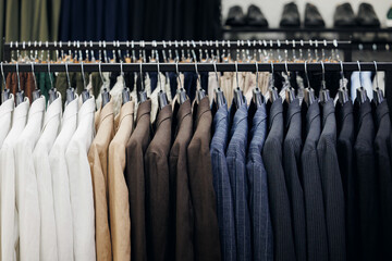 Row of fashion business suit for man in retail clothes store