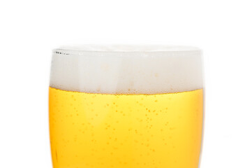 close-up view of glass of beer with foam
