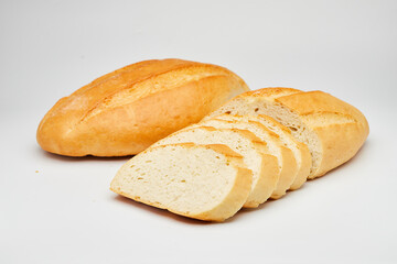 Freshly baked white bread loaf, sliced and ready to serve, perfect for sandwiches and breakfast