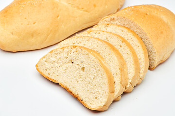Freshly baked white bread loaf, sliced and ready to serve, perfect for sandwiches and breakfast
