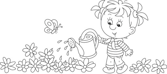 Happy little girl watering garden flowers on a pretty small flowerbed