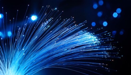 Blue Data Stream Fiber optic cables transmit data as a luminous current, illuminating the darkness with vibrant, electric blue bokeh.
