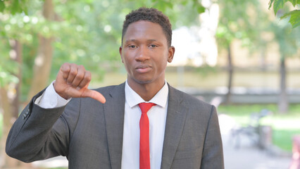 Thumbs Down by African Businessman Outdoor