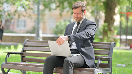 Obraz premium Middle Aged Businessman Coming, Sitting Outdoor to Use Laptop