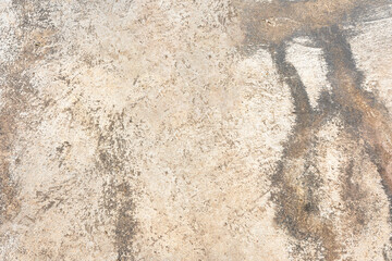 Rough gray stone wall texture with a grunge appearance and old, weathered surface