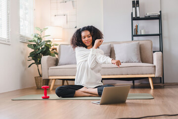 Happy African American Woman Stretching on Yoga Mat at Home.
