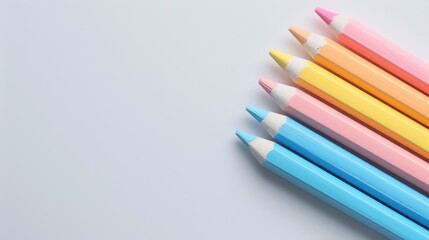 Fototapeta premium Colorful Education Back to School Background with Vibrant Pencils on White Surface for Creative Learning and Classroom Inspiration