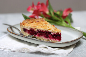 Slice of homemade berry pie on a plate. Selective focus.