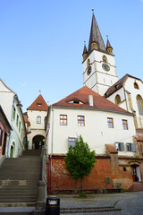 Cityscape from the Old Town of Sibiu: Staircase Tower (Turnul Scărilor), old houses and the bell tower of the Cathedral of St. Mary. A journey through the most beautiful places in the Transylvania 