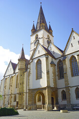 View of the main facade of the Church of Saint Mary (Catedrala Evanghelică Sfânta Maria in Romanian) in Sibiu. Gothic architecture in Transylvania - Historical landmarks of Romania.