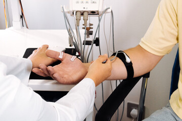 EMG measurement system. Patient's nerve testing using electromyography to assess muscle function....
