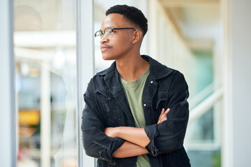 Black man, thinking and business with ambition for career, startup or job opportunity at office. Young African or creative employee with glasses in wonder, thought or confidence for future or dream