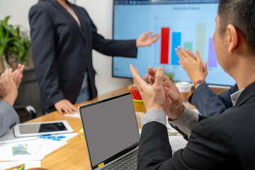 A businesswoman is presenting a project execution plan in a meeting