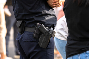 Close up of policeman's gun, self defense