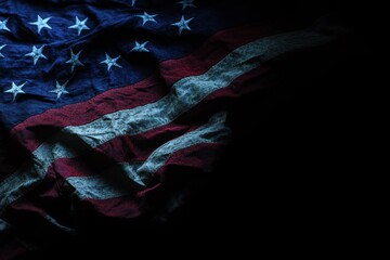 Close-up of an American flag with dark background