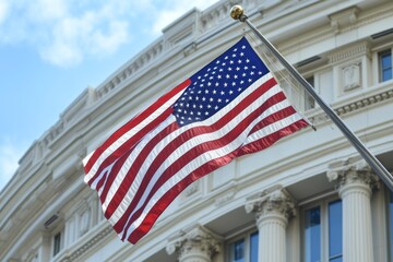Fototapeta premium American Flag Waving in Front of a White Building