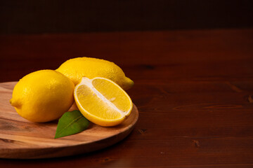 Lemons on a wooden plate