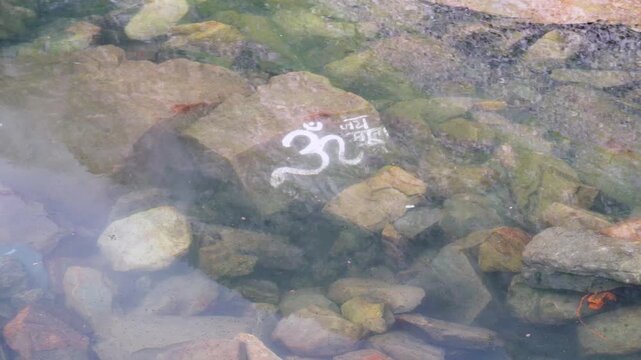 Underwater Stone Inscribed with Om at Gauri Kund, Foothills of Kailash Manimahesh